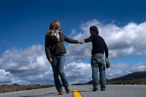 Couple Parting Ways on Highway --- Image by © Patricia Curi/Corbis